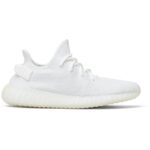 Perfil do tênis Yeezy Boost 350 V2 Vista lateral do Adidas Yeezy Boost 350 V2 Cream White, cabedal Primeknit branco sólido e sola BOOST translúcida
